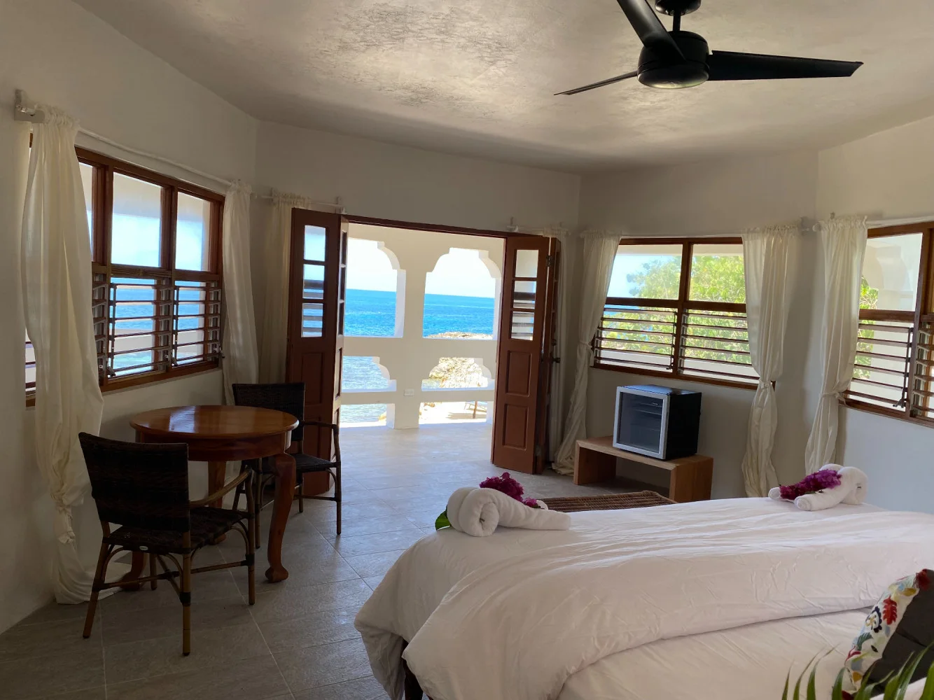 Airy bedroom and ocean view — Dolphin, Coral Cove Wellness Resort