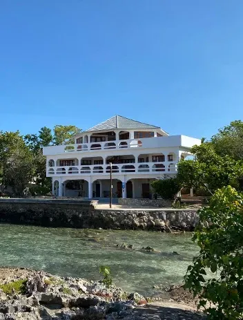 Jamaican dishes shared at the table at Coral Cove