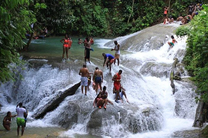 Visitors enjoying the cascades at Benta River Falls in Westmoreland