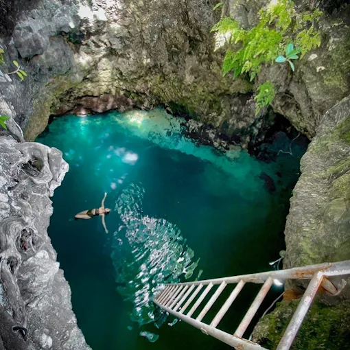 Looking down into Blue Hole Mineral Spring in Brighton, Jamaica