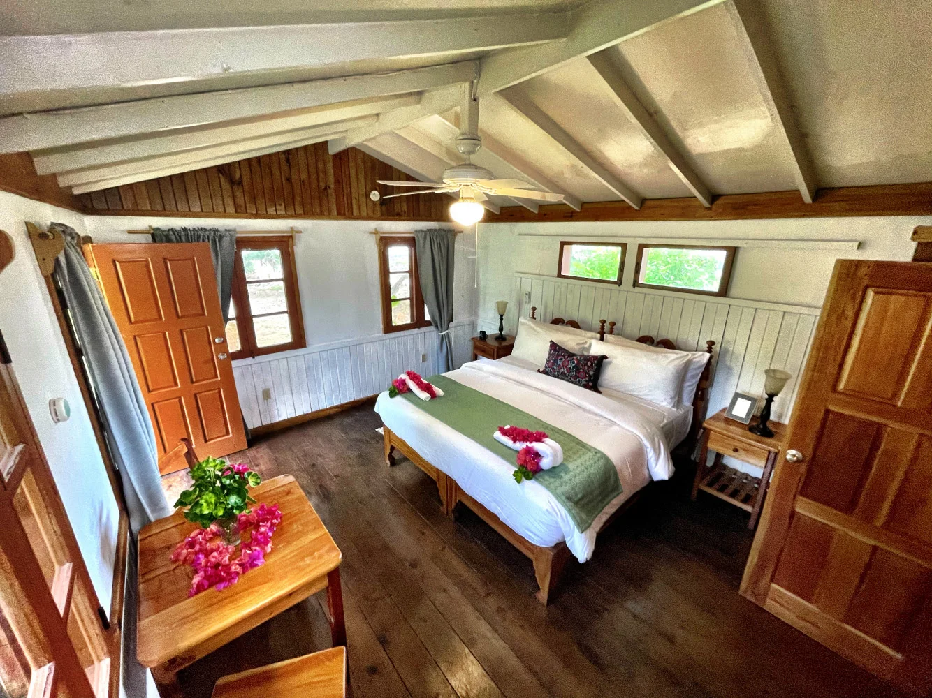 King bedroom in the wooden cottage — Hibiscus, Coral Cove Wellness Resort