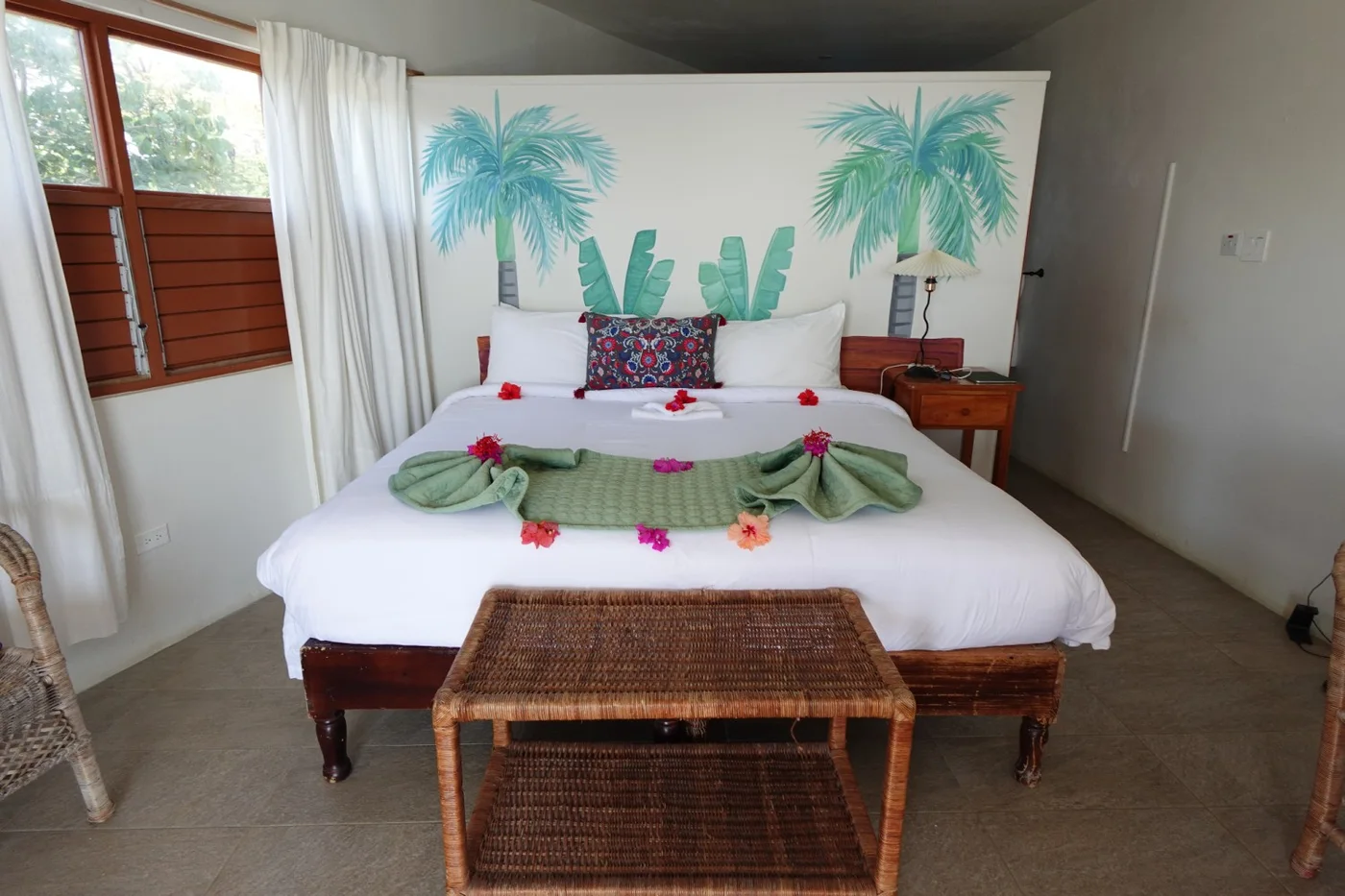 Bedroom with tropical wall mural — Marlin, Coral Cove Wellness Resort